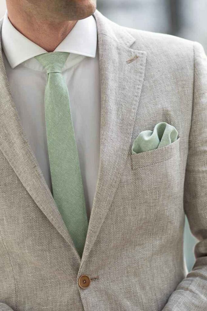 Grey Sweater with a Green Tie